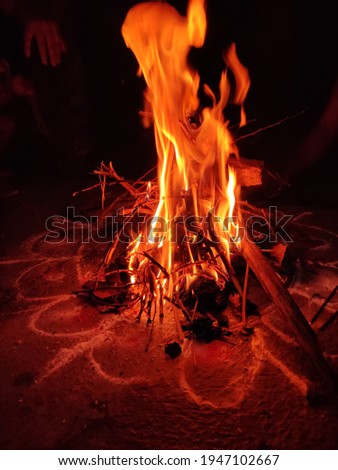 Holi ka Dahan close up image The fire is surrounded by people enjoying the festival Holi 