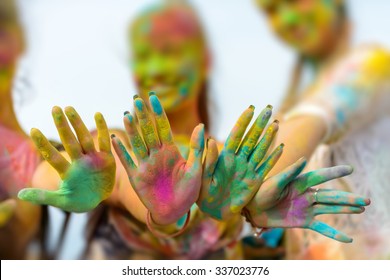 Holi Painted Hands Of Three Defocused Girls