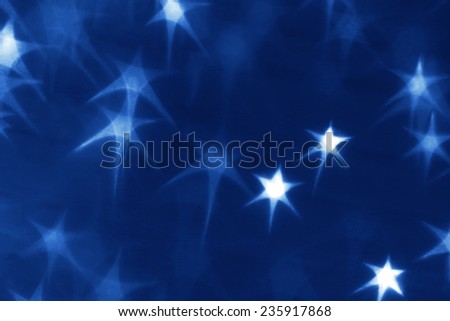 Holiday background with glowing stars
