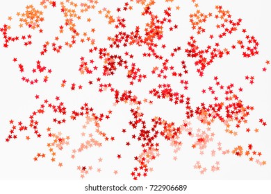 Holiday Background With Red And Orange Star Confetti. Good Background For Christmas And New Year Cards.