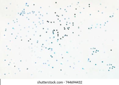 Holiday Background With Silver And Blue Star Confetti. Good Background For Christmas And New Year Cards.