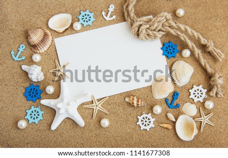 Holiday beach concept with shells, seastars and  blank postcard