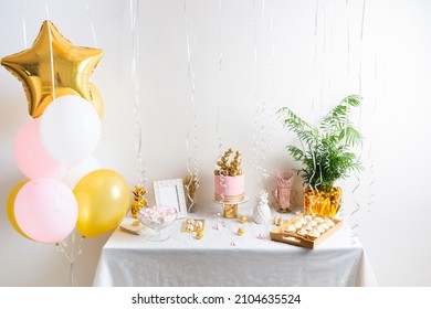 Holiday Birthday Table With Cake And Ballons. Pink And Golden Decoration