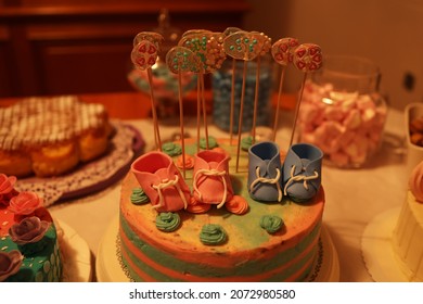 A Holiday Cake In Blue Pink Colors For A Gender Revelation Party.