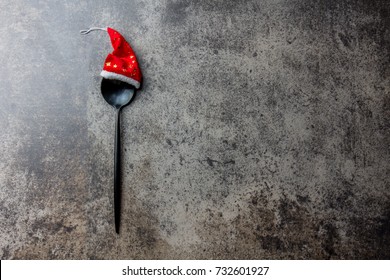 Holiday Christmas Food Background Concept. Christmas Menu Concept. Cutlery Spoon With Christmas Decoration, Stone Background, Copy Space.