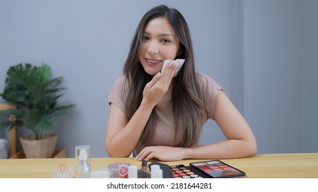 Holiday concept of 4k Resolution. Asian girl using facial oil control blotting paper at home.