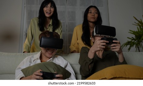 Holiday Concept Of 4k Resolution. Asian Woman Playing Video Game Using Vr In Living Room. Virtual Reality Technology.