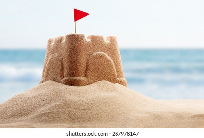 Holiday concept with sandcastle on the seaside - Shutterstock ID 287978147
