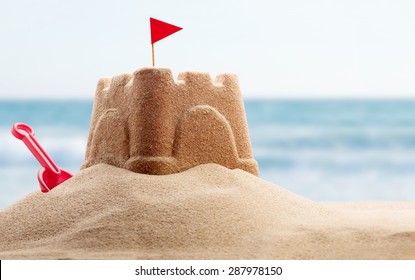 Holiday concept with sandcastle on the seaside - Shutterstock ID 287978150