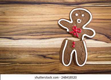 Holiday Cookie, A Gingerbread Man Broken In Half With A Scared Expression