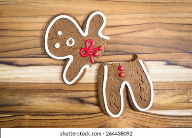 Holiday Cookie, A Gingerbread Man Broken In Half With A Scared Expression