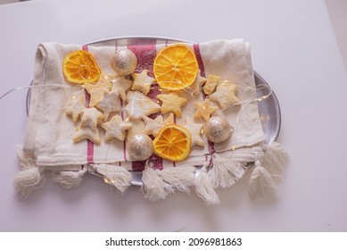 Holiday Cookies,New Year's Christmas Sweets, Cookies, With Dried Oranges And Lights, Festive Decorating Table