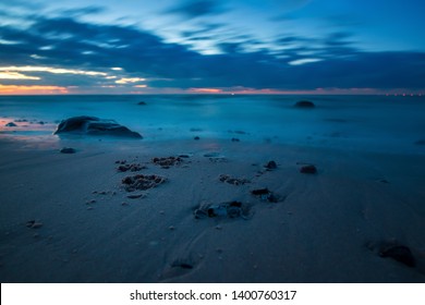 Holiday With Dog Paw Print In The Sand