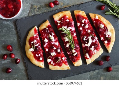 Holiday Flatbread Appetizer With Cranberries And Goat Cheese, Overhead Scene On A Slate Background