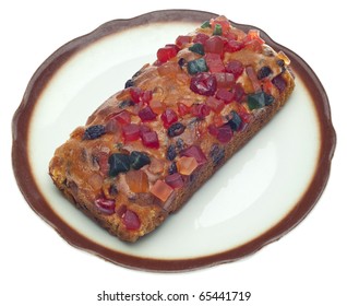 Holiday Fruit Cake On A Dish Isolated On White With A Clipping Path.