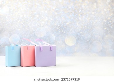 Holiday gift boxes and packages on bokeh background with place for text,new year sale and shopping concept, black friday,advertising banner for store and screen, selective focus