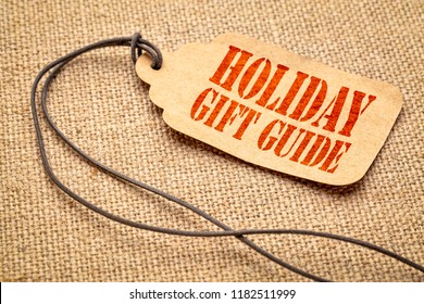 Holiday Gift Guide Sign - A Paper Price Tag With A Twine Iagainst Burlap Canvas