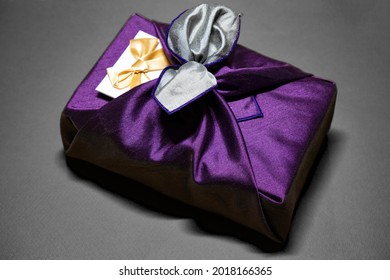 Holiday Gift Wrapped In High-quality Fabric