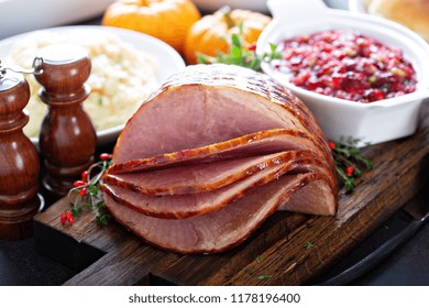 Holiday Glazed Sliced Ham On Dinner Table For Thanksgiving Or Christmas