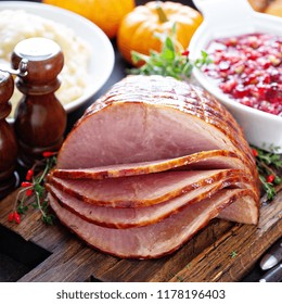 Holiday Glazed Sliced Ham On Dinner Table For Thanksgiving Or Christmas