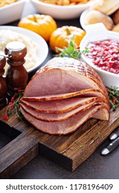 Holiday Glazed Sliced Ham On Dinner Table For Thanksgiving Or Christmas