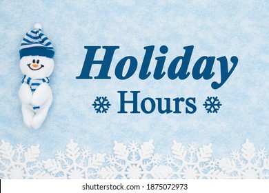 Holiday Hours Message With A Happy Snowman With Blue Snowflakes