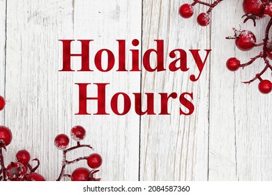 Holiday Hours Sign With Holly Berry Branch On Grunge Whitewash Wood