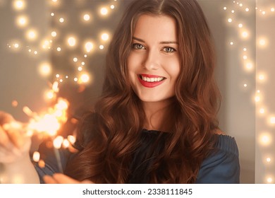 Holiday magic, Christmas and New Year celebration, happy woman with sparklers, portrait - Powered by Shutterstock