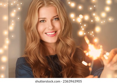 Holiday magic, Christmas and New Year celebration, happy woman with sparklers, portrait - Powered by Shutterstock