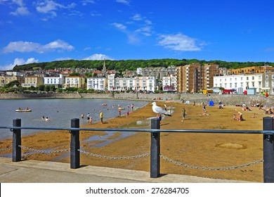 Holiday makers enjoying a beautiful summer day on the sandy beach at Weston Super Mare, Somerset, United Kingdom