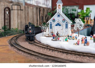 Holiday Model Train Display With Steam Engine And Church With Miniature Figures