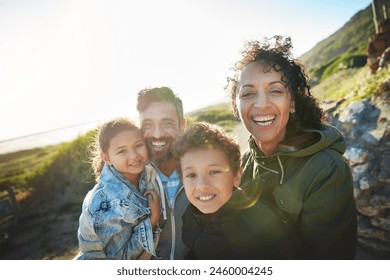 Holiday, mountain and outdoor portrait of family with smile, nature and bonding together on travel adventure. Mom, dad and children on summer vacation with hiking, happy face and sunshine on hill - Powered by Shutterstock