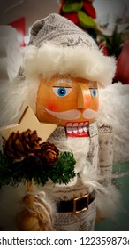 Holiday nutcracker with greenery