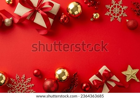 Holiday Ornament Arrangement: Top view of artisanal gift boxes, chic tree embellishments, red and gold balls, glimmering star, snowflakes, mistletoe berries on red surface, ready for your festive text