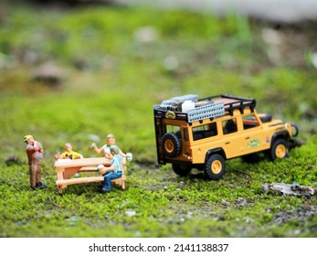 Holiday at outdoor concept. Travelling with adventure car. Unfocus view on the green land. Blurred background.