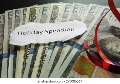 Holiday Spending Note On Cash, With Red Ribbon                               