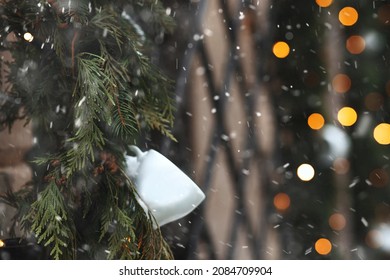 Holiday Street Decoration With Glowing Garland And Spruce Branches. Empty Space