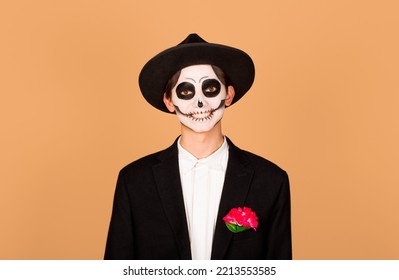 Holiday, Theme Party And People Concept - Happy Smiling Man In Halloween Costume Of Dead Mexican Over Beige Background