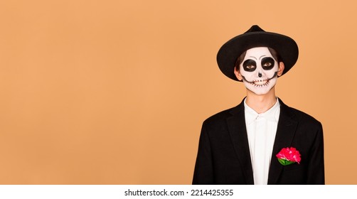 Holiday, Theme Party And People Concept - Happy Smiling Man In Halloween Costume Of Dead Mexican Over Beige Background