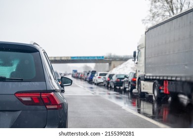 Holiday Traffic, Traffic Jam On A German Autobahn. Cars From Behind, Just Before A Bridge