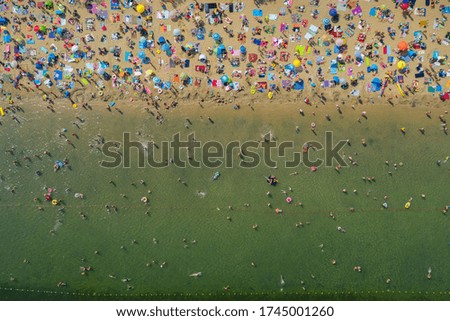 Similar – Aerial Summer View Of Clear Ocean Water Full Of Tourists