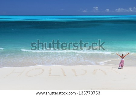 Holiday writing on the desert beach of Exuma, Bahamas