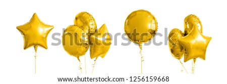 holidays and birthday party decoration concept - many metallic gold helium balloons of different shapes over white background