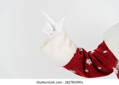 Holidays And Christmas Concept. Santa Claus Points With His Hand. No Face. Isolated On White