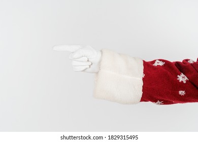 Holidays And Christmas Concept. Santa Claus Points With His Hand. No Face. Isolated On White