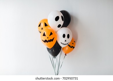 holidays, decoration and party concept - bunch of scary air balloons for halloween over white background - Powered by Shutterstock