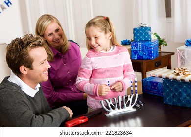 Holidays: Family Lighting Hanukkah Candles Together