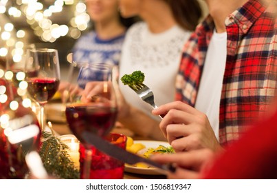 Holidays, Healthy Food And Celebration Concept - Close Up Of Friends Having Christmas Dinner And Eating