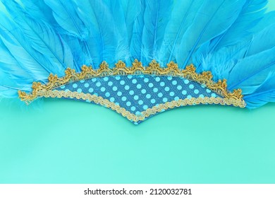 Holidays image of mardi gras and brazil masquarade carnival decoration over blue background. view from above