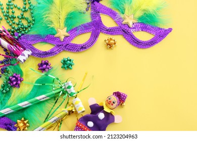Holidays image of mardi gras and brazil masquarade carnival mask over yellow background. view from above